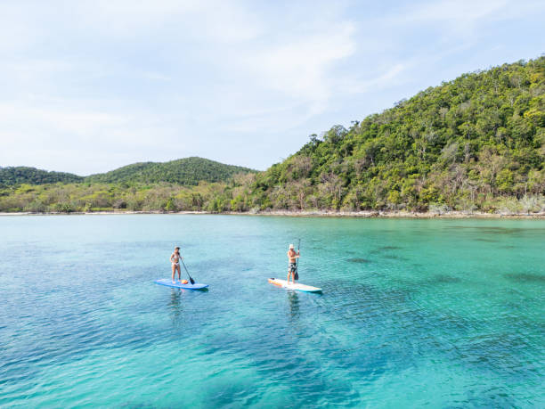 istock Two Paddleboarders Near Lush Hills 2152693828