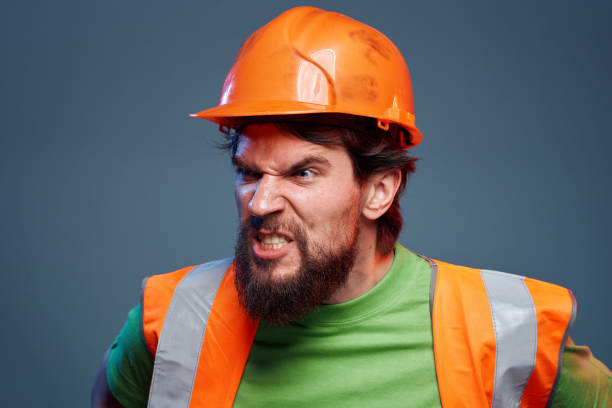 istock emotional man worker orange paint hard work 2152693895