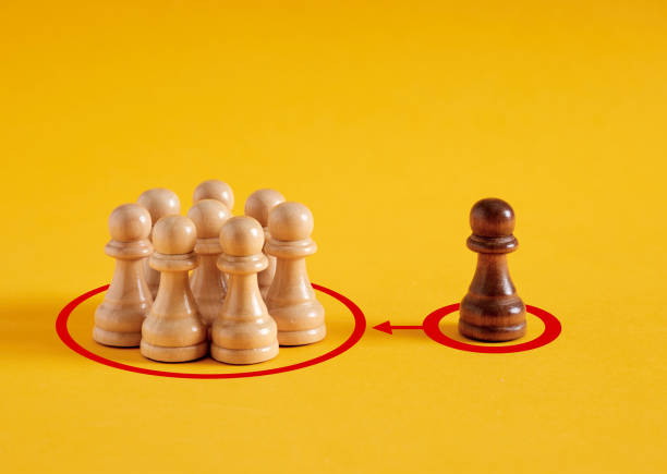 istock To exert influence and pressure on a group. Group control. 2152693937