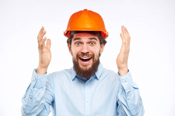 istock Cheerful male orange hard hat safety professional construction engineer 2152694114