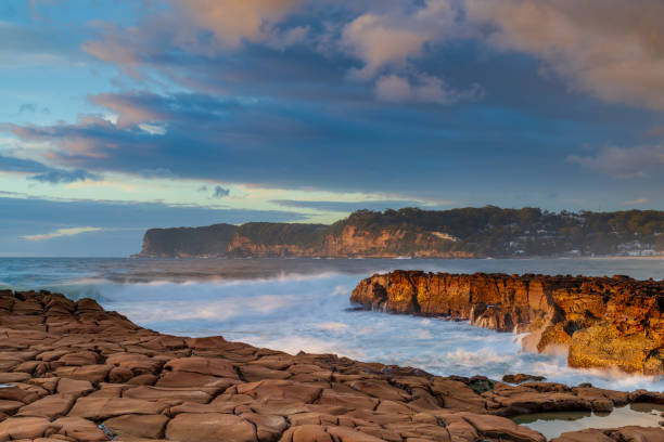 istock Sunrise, sea, waves, clouds and tessellated rock platform 2152694377