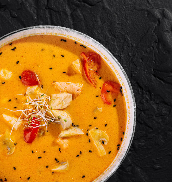 istock Spicy thai chicken curry in bowl on black background 2152694442