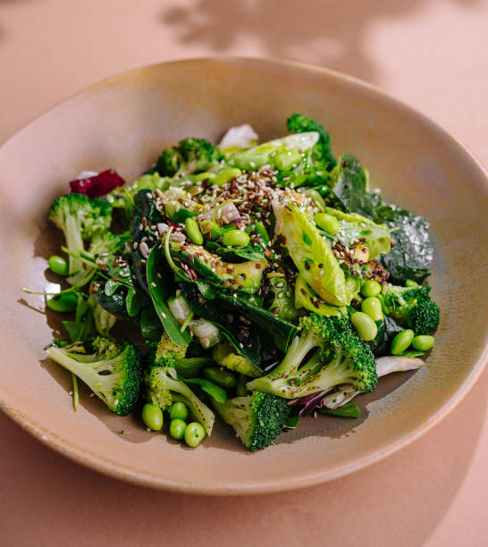 istock Fresh green salad on pastel background 2152694444