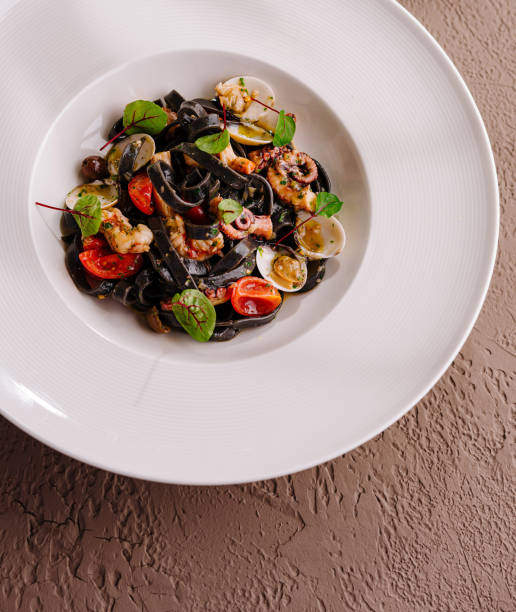 istock Gourmet seafood pasta with squid ink spaghetti 2152694618