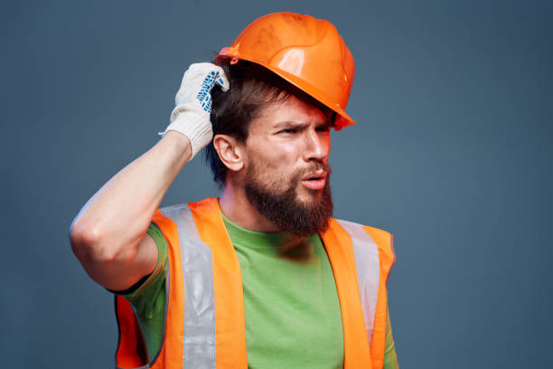 istock worker man in construction uniform professional lifestyle blue background 2152695202