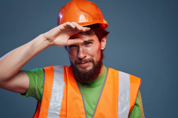 istock Bearded man in work uniform construction professional cropped view 2152695289