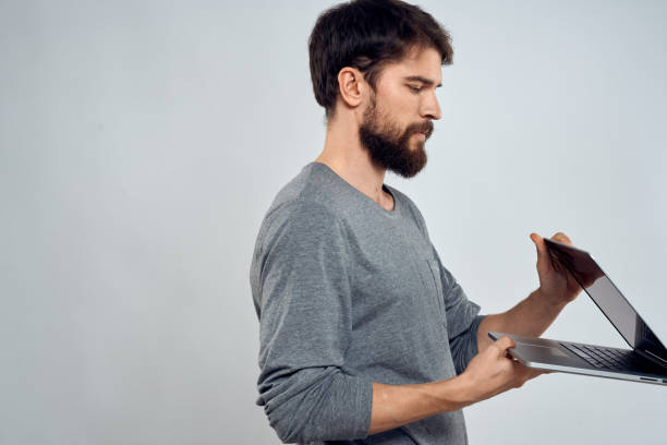 istock Emotional man holding a laptop success modern style work light background 2152697100