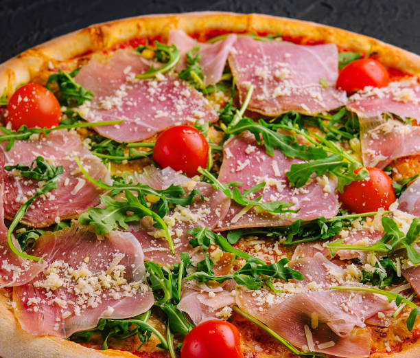 istock Gourmet italian pizza with prosciutto and arugula 2152697441