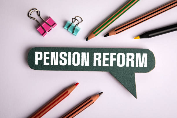 istock Pension Reform. Speech bubble with text on white office desk 2152698011