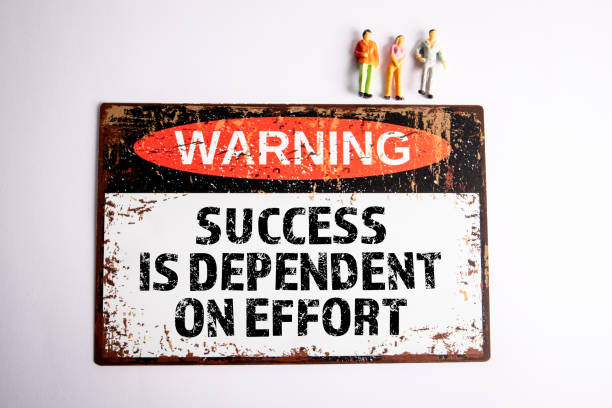 istock Success is Dependent on Effort. Warning sign with text on a white background 2152698030