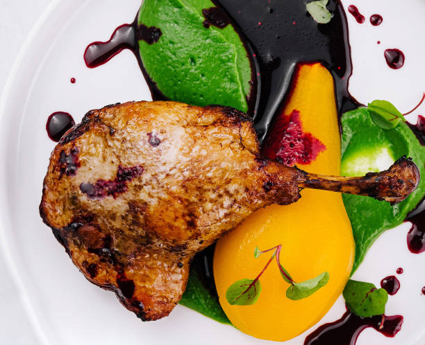istock Gourmet chicken dish with colorful purees on white plate 2152698208