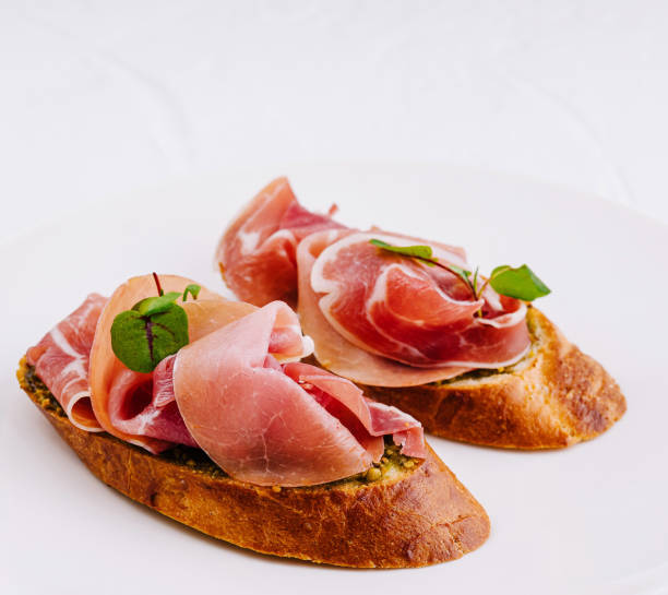 istock Elegant prosciutto bruschetta on white plate 2152698682