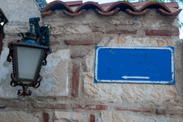 istock Vintage wall lamp hanging on an old house 2152699057
