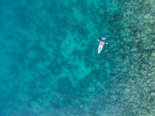 istock Overhead View of Solo Kayaker in Deep Blue Waters 2152699235