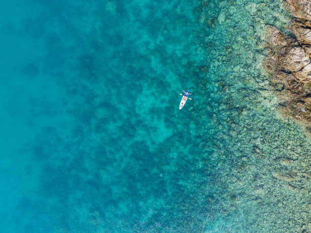 istock A Kayaker Paddling Near Rocky Shoreline 2152699241