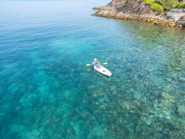 istock Peaceful Kayaking Near Rocky Coastal Line 2152699288