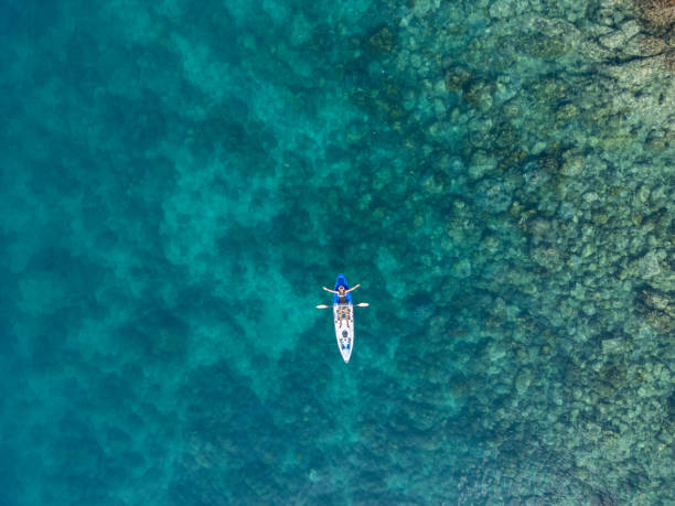 istock Lone Kayaker Celebrating in Crystal Clear Waters 2152699305