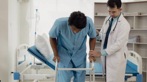 istock Professional physical therapist examines and cares for a young man in a physical therapy center, treating muscles and injuries of a man in a hospital. 2152701715