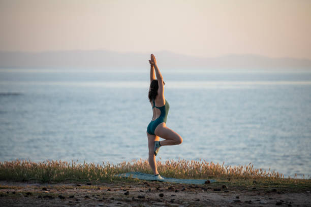 istock Yoga practice at sunset. 2152702456
