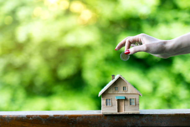 istock Real Estate Agent with house model and saving concepts 2152703664