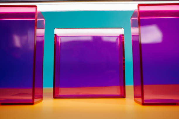 Three vibrant rectangular boxes, each a different shade of purple such as magenta, are displayed on a sunny yellow table. Bright summer y2k product display background