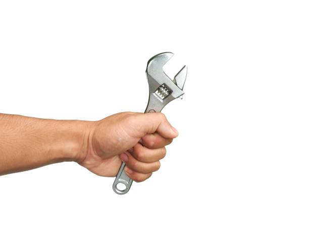 istock A man's hand is holding a mechanic's tool called an adjustable wrench for use in mechanic work.  or industry in factories, is a device for tightening nut heads  Isolated on a white background. 2152705586