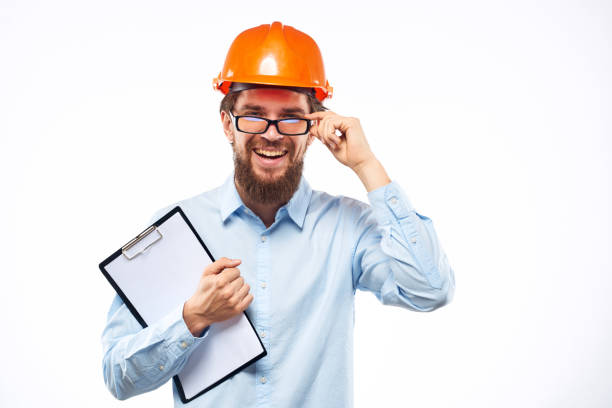 istock Cheerful man in orange hard hat construction documents service professionals 2152707408
