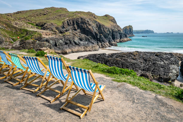 A stunning seascape view over the cliffs and across the beach in beautiful Porthtowan, Cornwall on sunny summer day