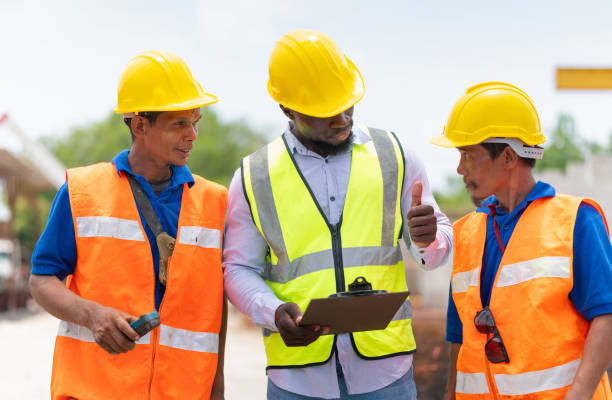 istock Engineer man and builders team in hardhats discussing on construction site, Foreman and worker checking project at the precast factory site 2152707782