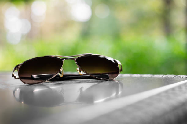 Trendy fashionable sunglasses on  table . Copy space