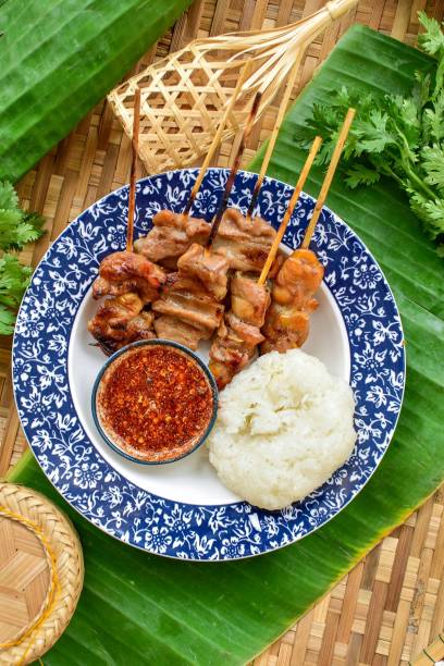 grilled pork and sticky rice  thai style on banana leaf, top view, thai called Moo ping, bbq pork
