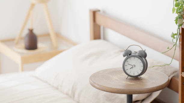 istock Unattended bed and alarm clock 2152710285