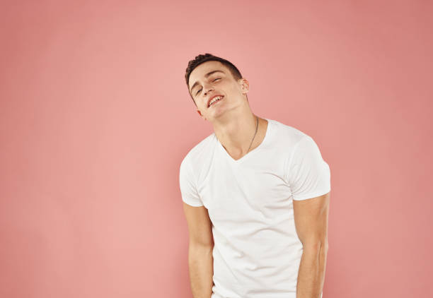istock Cute man in t-shirt studio pink background fun 2152710595