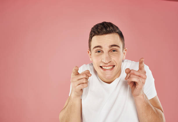istock handsome man in white t-shirt cropped view pink background 2152710602