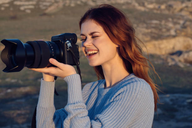 istock woman professional photographer outdoors hobby work landscape 2152716146