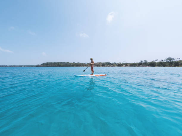 istock A Man Paddleboarding Solo on Tranquil Waters 2152716803