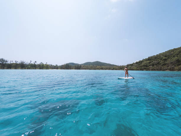 istock A Man Paddle boarding in a Tropical Paradise 2152716804