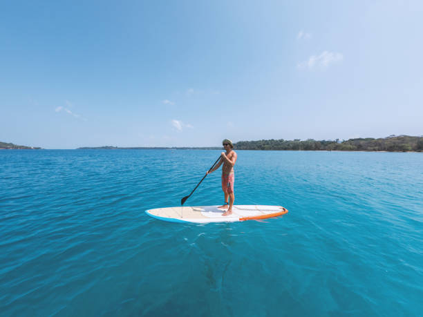 istock Serene Paddleboarding Journey on Crystal Clear Waters 2152716812