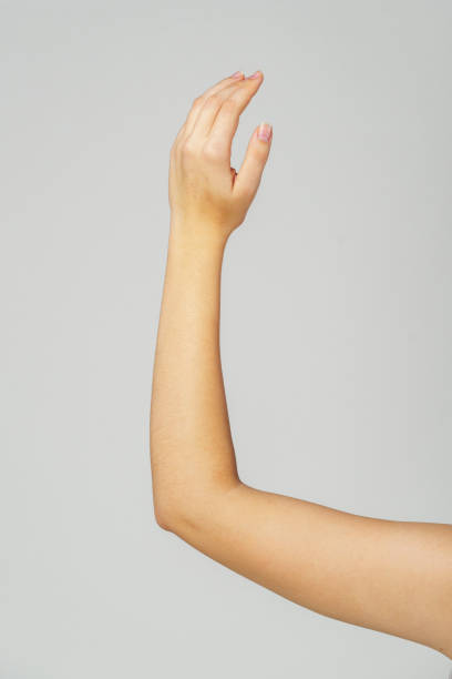Young Woman Arm with Gesture close up on gray background