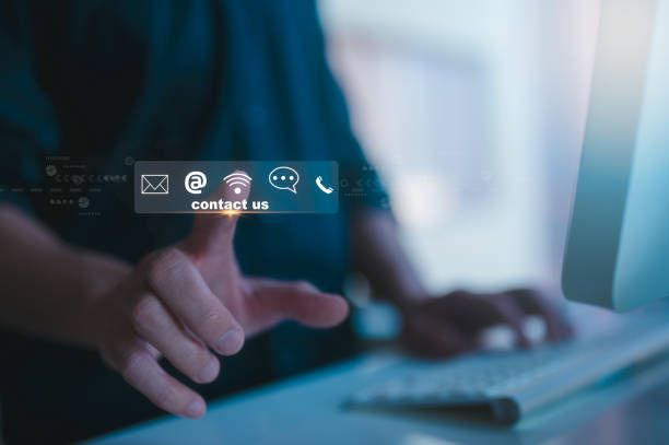 istock Contact us or Customer support hotline people connect. Businessman pointing virtual screen contact icons  email, address, live chat, internet wifi 2152717478