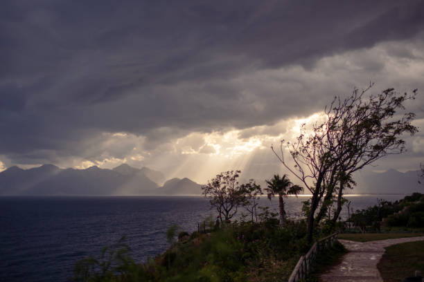 God's light touches the sea through the clouds