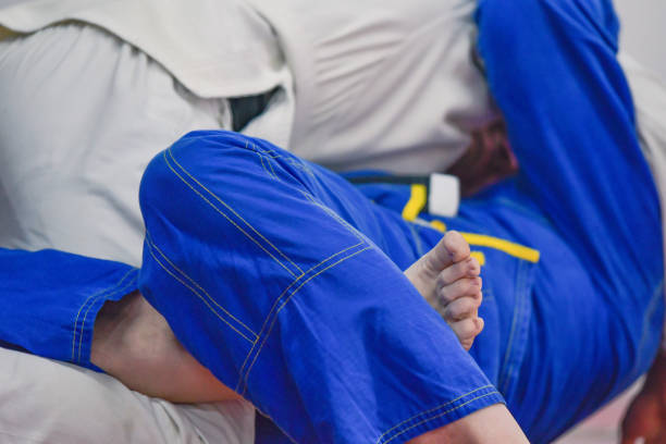 Training martial arts in the Gi, kimono judo, belts copy space selective focus background image
