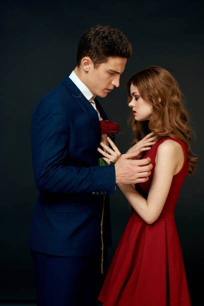 istock luxury couple hug romance relationship rose over dark isolated background 2152719466