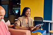 smiling-african-american-businesswoman-in-a-plaid-blazer-holding-a-tablet-in-a-modern-office.jpg?b=1&s=170x170&k=20&c=yvzVlJn0xzMPxvlrGplKQtU2g1HrV8poBnbapHbzD6U=