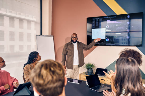 istock Multiracial business team in a meeting with data analysis presentation in a modern office. Corporate strategy and analytics concept 2152719753