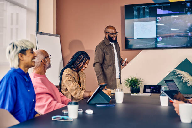 istock Multiracial business team in a meeting with data analysis presentation in a modern office. Corporate strategy and analytics concept 2152719788