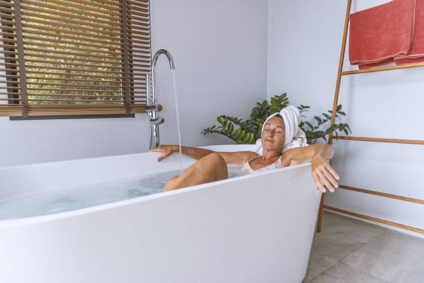 istock An elegant woman unwinding during bath time 2152724745