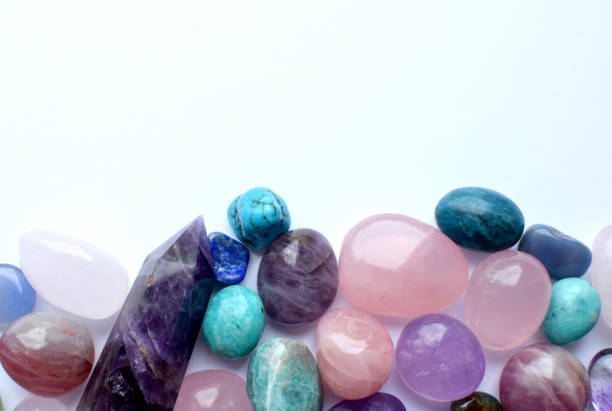 istock Multicolored healing chakra crystals.  Copy space. Real semi-precious stones: rose quartz,  citrine, agate, apatite, kyanite, fluorite. 2152727277