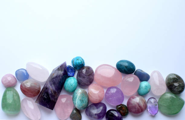 istock Multicolored healing chakra crystals.  Copy space. Real semi-precious stones: rose quartz,  citrine, agate, apatite, kyanite, fluorite. 2152727289