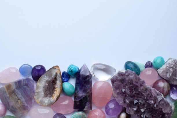 istock Multicolored healing chakra crystals.  Copy space. Real semi-precious stones: rose quartz,  citrine, agate, apatite, kyanite, fluorite. 2152727290